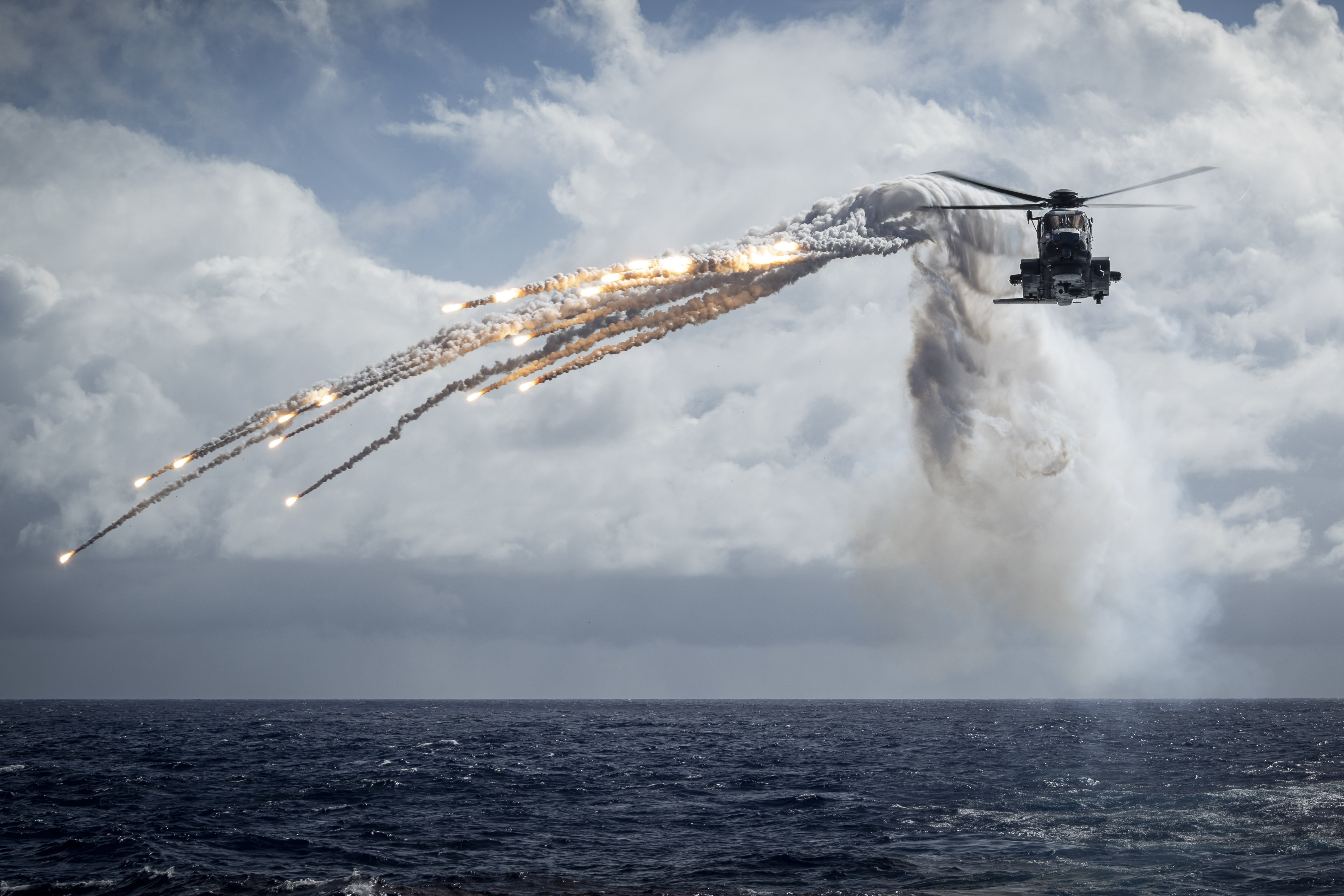 HMCS Ottawa’s embarked CH-148 Cyclone helicopter ‘GREYWOLF’ conducts a flare and chaff launch exercise during INDO-PACIFIC deployment on September 4th, 2023  Credit: Aviator Gregory Cole, CAF